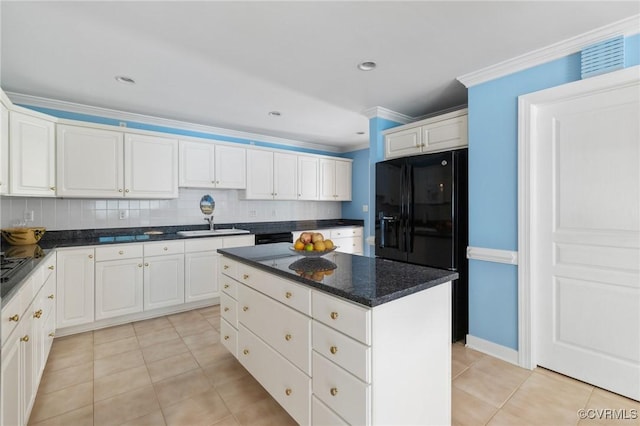 4410 Sharonridge Dr, North Chesterfield, VA 23236 - kitchen with light tile patterned flooring, a center island, black fridge, crown molding, and tasteful backsplash