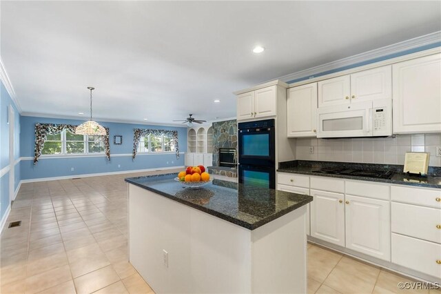 4410 Sharonridge Dr, North Chesterfield, VA 23236 - kitchen with black appliances, light tile patterned floors, a kitchen island, decorative backsplash, and ornamental molding