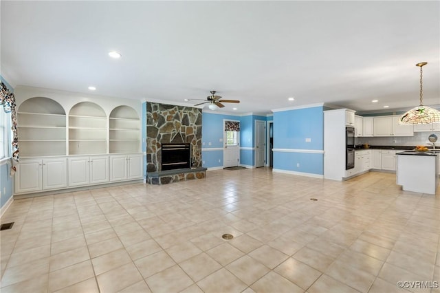 4410 Sharonridge Dr, North Chesterfield, VA 23236 - unfurnished living room featuring ceiling fan, light tile patterned floors, ornamental molding, a stone fireplace, and recessed lighting