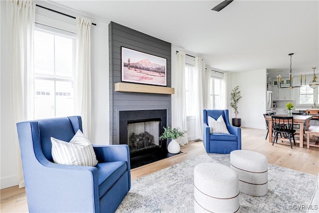 3013 Swanns Inn Cres, Goochland, VA 23063 - living room with a fireplace, light wood-style floors, and ceiling fan