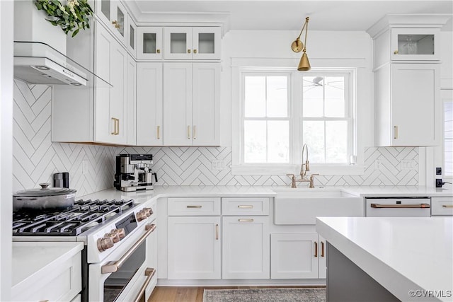 3013 Swanns Inn Cres, Goochland, VA 23063 - kitchen featuring white appliances, wall chimney range hood, light countertops, white cabinets, and tasteful backsplash