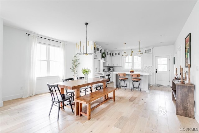 3013 Swanns Inn Cres, Goochland, VA 23063 - dining area featuring light wood-style floors and a chandelier