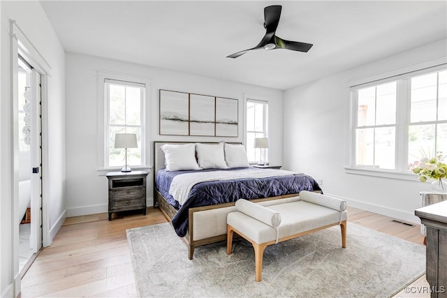3013 Swanns Inn Cres, Goochland, VA 23063 - bedroom with multiple windows, light wood finished floors, and a ceiling fan