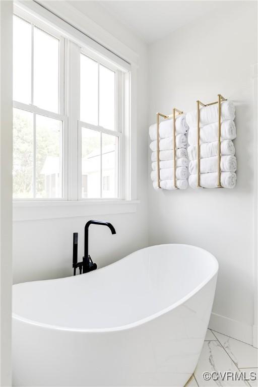 3013 Swanns Inn Cres, Goochland, VA 23063 - bathroom with a freestanding tub, healthy amount of natural light, and marble finish flooring