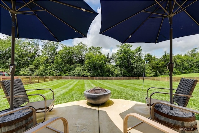 3013 Swanns Inn Cres, Goochland, VA 23063 - fenced backyard featuring a patio, a fire pit, and view of wooded area