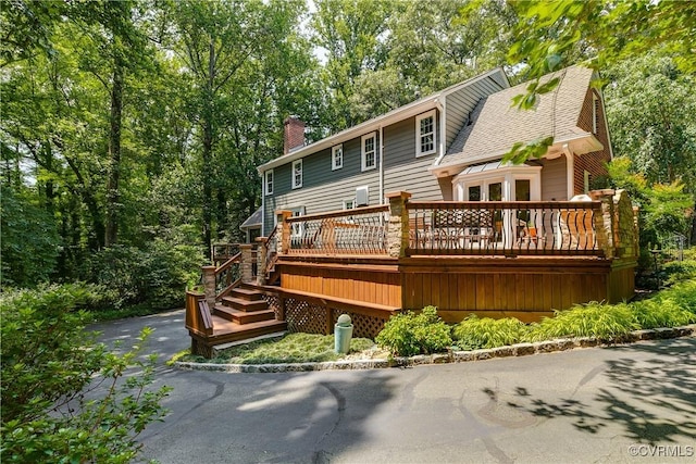 12103 Wexwood Pl, North Chesterfield, VA 23236 - rear view of house with a chimney, a deck, and a shingled roof