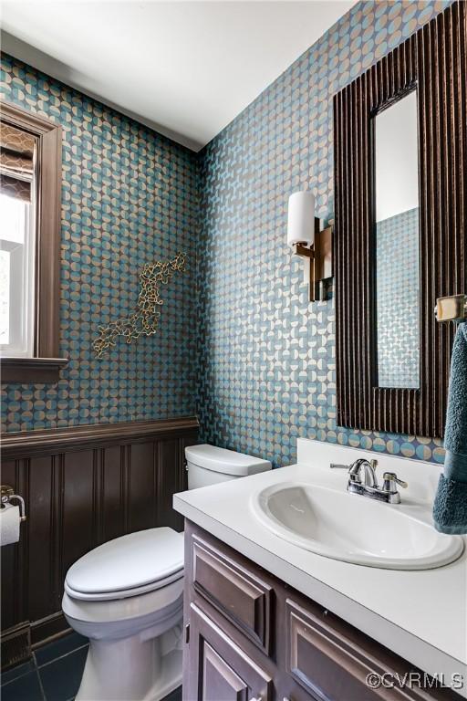 12103 Wexwood Pl, North Chesterfield, VA 23236 - half bathroom with wallpapered walls, vanity, a wainscoted wall, and tile patterned floors