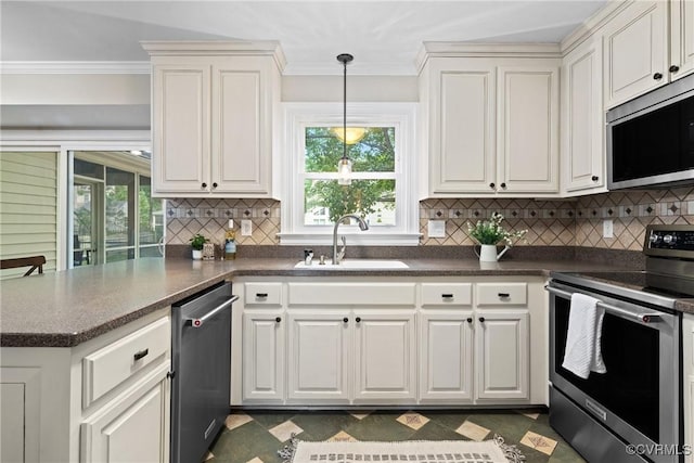 2801 Aspinwald Dr, Henrico, VA 23233 - kitchen featuring stainless steel appliances, dark countertops, a peninsula, healthy amount of natural light, and ornamental molding