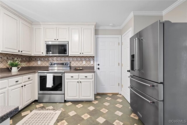 2801 Aspinwald Dr, Henrico, VA 23233 - kitchen featuring appliances with stainless steel finishes, dark countertops, decorative backsplash, ornamental molding, and light floors