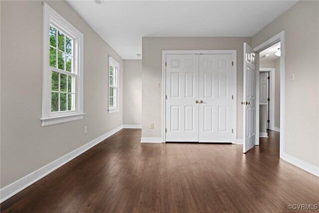 2801 Aspinwald Dr, Henrico, VA 23233 - unfurnished bedroom with dark wood-style flooring and a closet