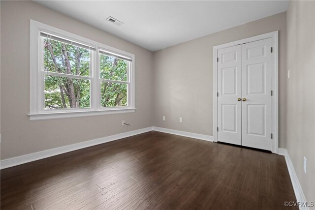2801 Aspinwald Dr, Henrico, VA 23233 - unfurnished bedroom with dark wood-type flooring and a closet