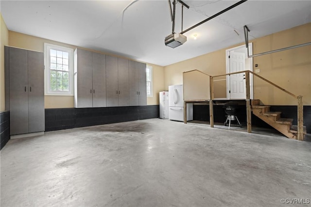 2801 Aspinwald Dr, Henrico, VA 23233 - garage with a garage door opener and freestanding refrigerator