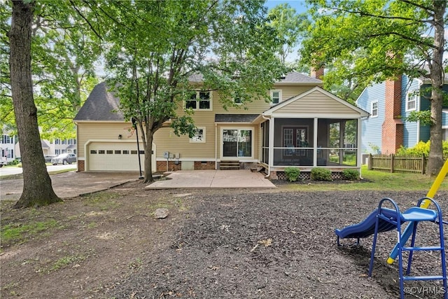 2801 Aspinwald Dr, Henrico, VA 23233 - back of house with a sunroom, an attached garage, a patio area, a chimney, and driveway