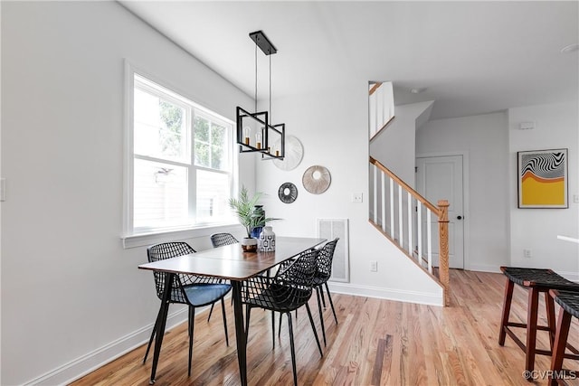 18 W 29th St, Richmond, VA 23223 - dining room with light wood-style floors and stairs