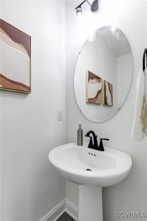 18 W 29th St, Richmond, VA 23223 - bathroom with a sink and baseboards