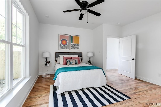 18 W 29th St, Richmond, VA 23223 - bedroom with multiple windows, light wood-style flooring, and ceiling fan