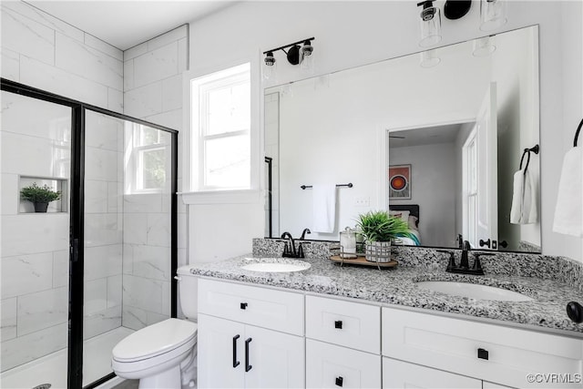 18 W 29th St, Richmond, VA 23223 - bathroom featuring a stall shower, double vanity, and ensuite bathroom