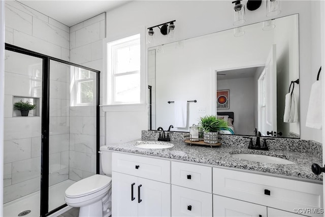 18 W 29th St, Richmond, VA 23223 - bathroom featuring a shower stall, double vanity, and ensuite bathroom