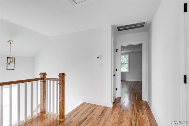 18 W 29th St, Richmond, VA 23223 - hallway with light wood-type flooring and an upstairs landing