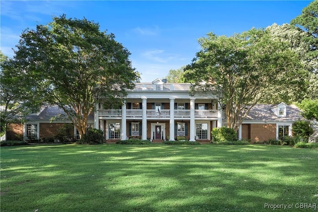985 Kingston Ln, North, VA 23128 - greek revival house featuring a balcony, a front yard, and a porch