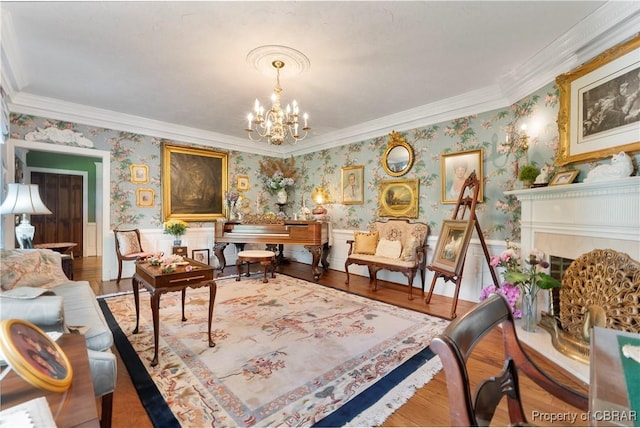 985 Kingston Ln, North, VA 23128 - living area featuring wallpapered walls, a chandelier, ornamental molding, and wood finished floors