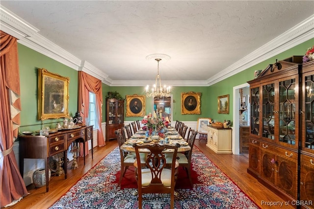 985 Kingston Ln, North, VA 23128 - dining space featuring a chandelier, crown molding, and wood finished floors