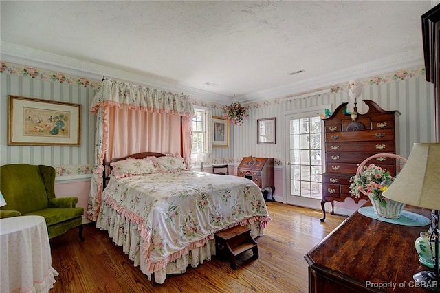 985 Kingston Ln, North, VA 23128 - bedroom featuring wallpapered walls, wood finished floors, multiple windows, and ornamental molding