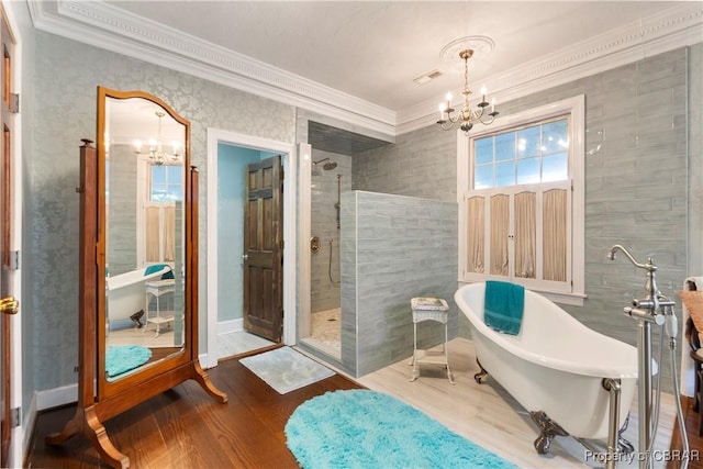 985 Kingston Ln, North, VA 23128 - full bathroom with a chandelier, crown molding, a walk in shower, a freestanding bath, and wood finished floors