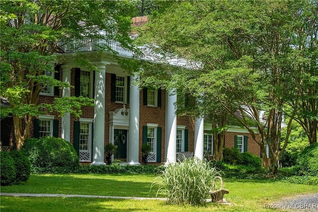 985 Kingston Ln, North, VA 23128 - view of front facade with brick siding and a front lawn