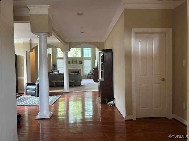 5623 Virginia Park Dr, Providence Forge, VA 23140 - hallway with decorative columns, crown molding, wood finished floors, and arched walkways