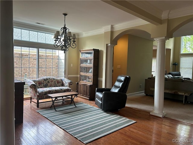 5623 Virginia Park Dr, Providence Forge, VA 23140 - living area with decorative columns, arched walkways, hardwood / wood-style floors, crown molding, and a chandelier