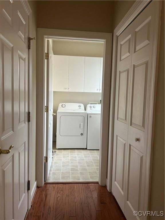 5623 Virginia Park Dr, Providence Forge, VA 23140 - laundry area with washer and clothes dryer, light wood-type flooring, and cabinet space