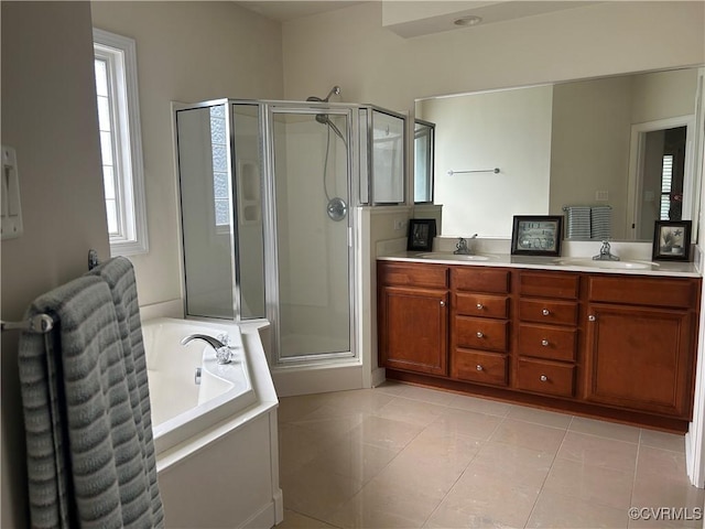 5623 Virginia Park Dr, Providence Forge, VA 23140 - bathroom with a stall shower, a bath, double vanity, and tile patterned flooring
