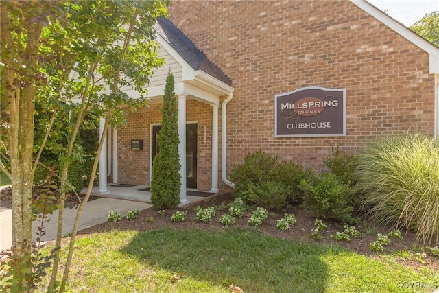 8750 Springwater Dr, Henrico, VA 23228 - doorway to property with brick siding and a porch