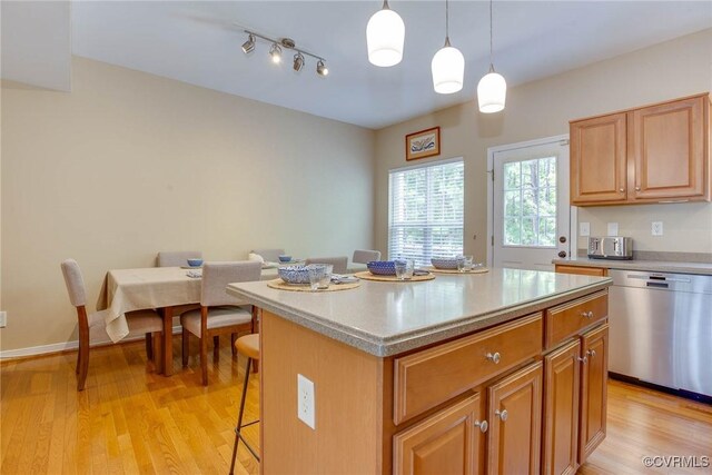 8750 Springwater Dr, Henrico, VA 23228 - kitchen with dishwasher, a kitchen bar, light wood-type flooring, light countertops, and a center island