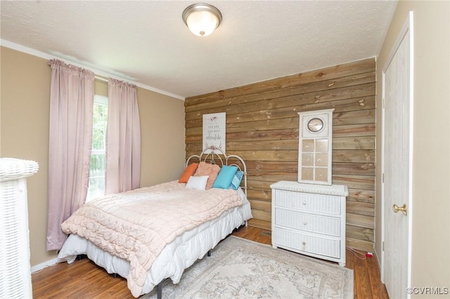 3737 Shelton Store Rd, Buckingham, VA 23921 - bedroom featuring wood finished floors, ornamental molding, and wooden walls