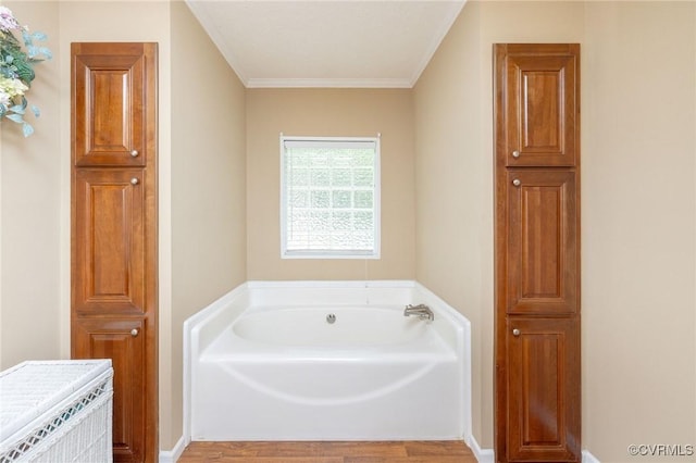 3737 Shelton Store Rd, Buckingham, VA 23921 - bathroom with a garden tub, wood finished floors, and crown molding