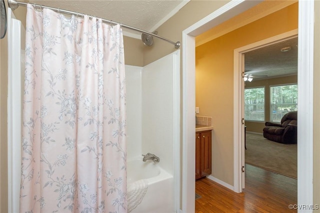 3737 Shelton Store Rd, Buckingham, VA 23921 - bathroom featuring wood finished floors, shower / tub combo, a textured ceiling, and vanity