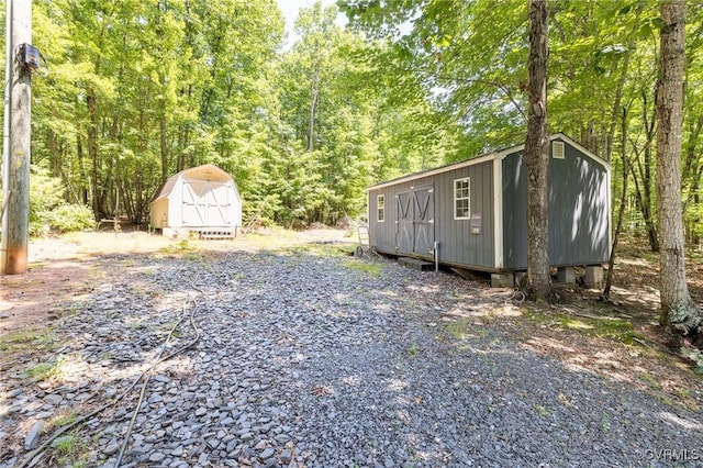 3737 Shelton Store Rd, Buckingham, VA 23921 - view of yard with a shed and a wooded view