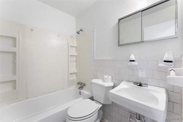 5425 Germain Rd, Richmond, VA 23224 - bathroom with washtub / shower combination, tile walls, built in features, and wainscoting