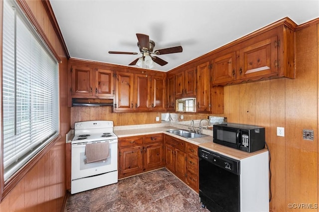 5425 Germain Rd, Richmond, VA 23224 - kitchen with black appliances, light countertops, a ceiling fan, brown cabinets, and under cabinet range hood