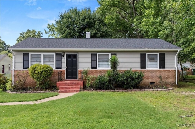5425 Germain Rd, Richmond, VA 23224 - view of front facade with brick siding, a front yard, a chimney, and roof with shingles