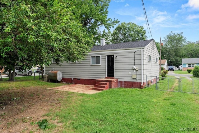 5425 Germain Rd, Richmond, VA 23224 - back of house with oil tank, a gate, a chimney, and crawl space