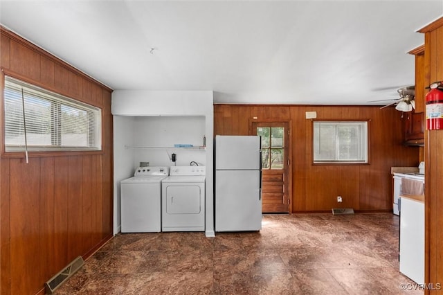 5425 Germain Rd, Richmond, VA 23224 - washroom featuring wood walls, washing machine and dryer, and a ceiling fan