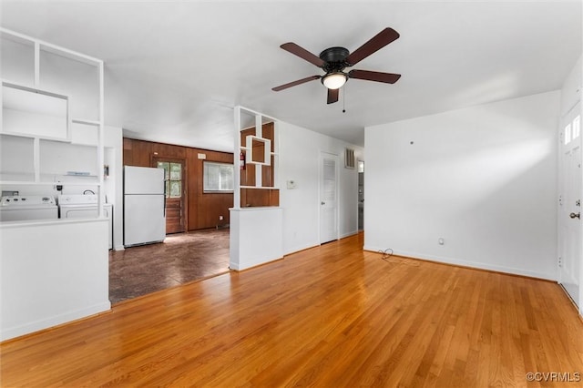 5425 Germain Rd, Richmond, VA 23224 - unfurnished living room featuring washer and clothes dryer, ceiling fan, and wood finished floors