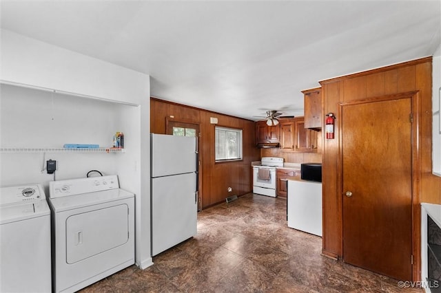 5425 Germain Rd, Richmond, VA 23224 - kitchen with white appliances, brown cabinetry, a ceiling fan, light countertops, and wood walls