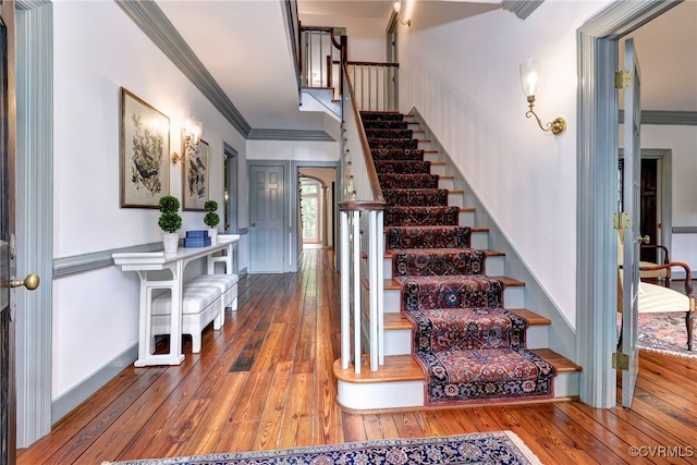 99 Walnut Hills Dr, Williamsburg, VA 23185 - stairs with crown molding and hardwood / wood-style floors