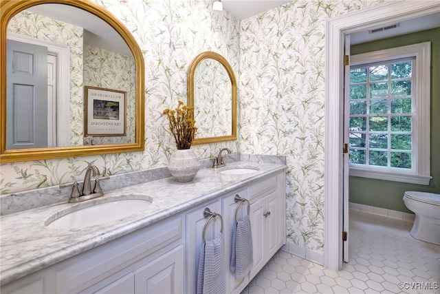 99 Walnut Hills Dr, Williamsburg, VA 23185 - bathroom with wallpapered walls, double vanity, and tile patterned flooring