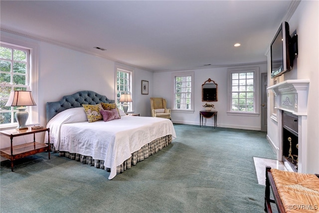 99 Walnut Hills Dr, Williamsburg, VA 23185 - carpeted bedroom with a fireplace with flush hearth, ornamental molding, and recessed lighting