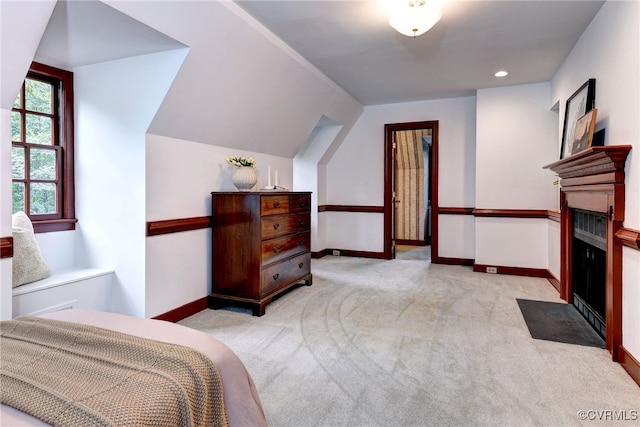 99 Walnut Hills Dr, Williamsburg, VA 23185 - bedroom with a fireplace with flush hearth, light colored carpet, vaulted ceiling, and recessed lighting